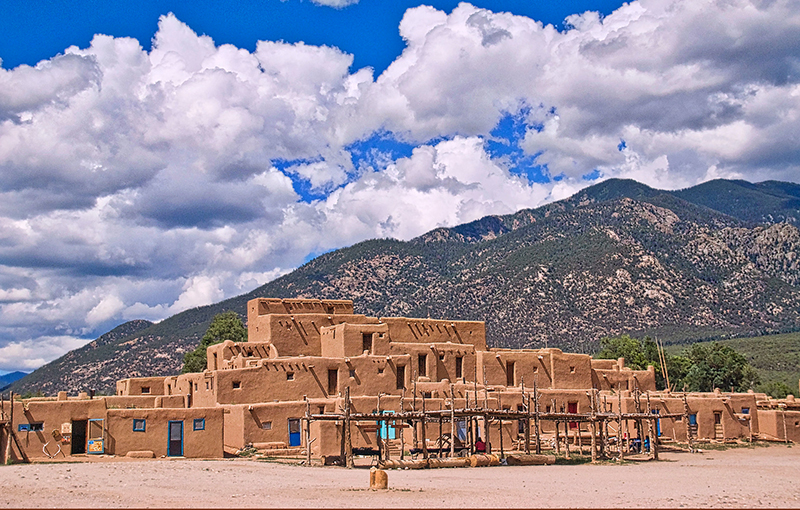 Taos Pueblo with Taos Mountain in Background photo by Ron Cogswell