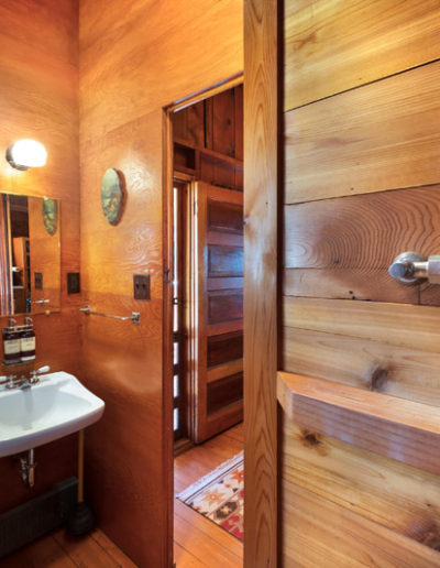Bathroom with wooden shower, antique style sink