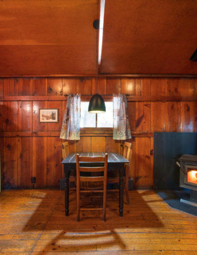 KNothole cabin kitchen with wood burning fireplace