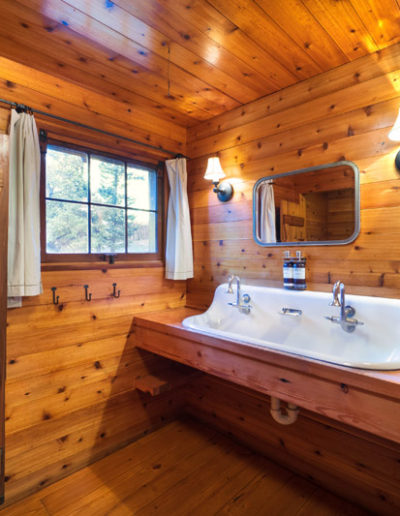 Penasco cabin bathroom with double sink and mirror