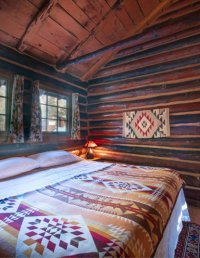 Log cabin bedroom and bed in the Ponderosa cabin