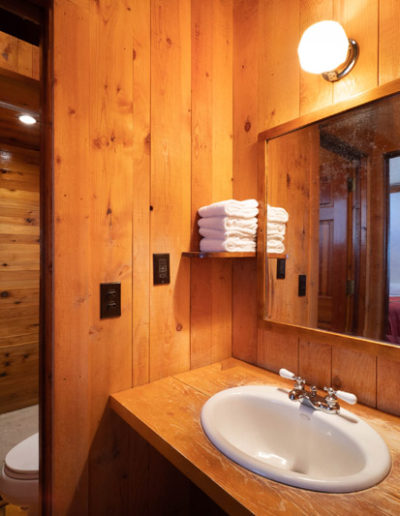 Cabin bathroom with sink and towels