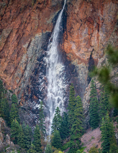 Steep waterfall flowing down rock cliffs