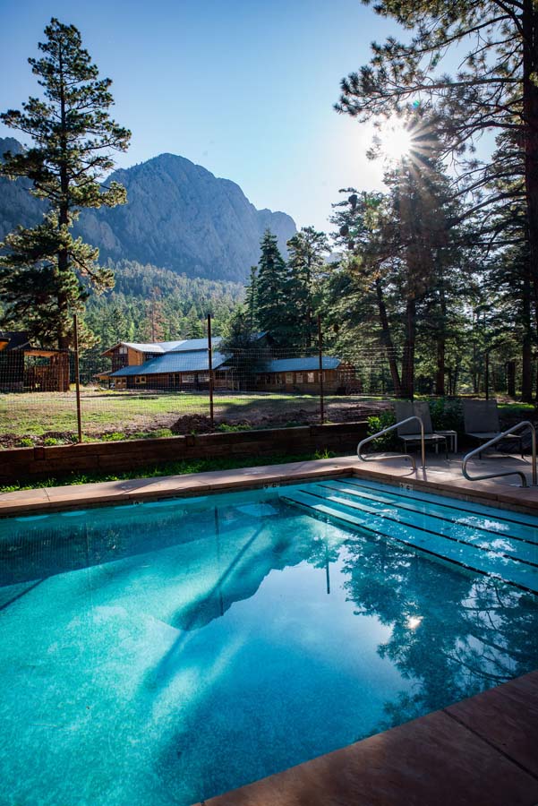 Swimming Pool at Corkins Lodge surrounded by pine trees